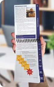 A photo of a person holding a QuickSeries pocket guide.