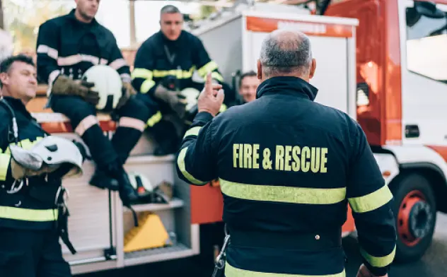 A leader of the Fire & rescue team discussing the plan to help citizens in their community