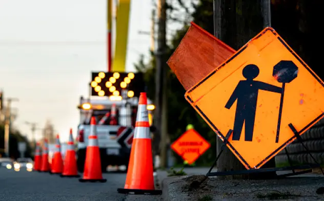 A city works yield sign with traffic cones showing there is work going on